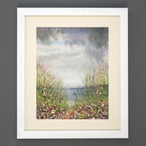 A framed print of a painting by Julia Tanner Art called Beside the Seaside