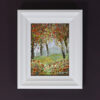 Autumn Colours II original acrylic woodland painting on canvas board framed in a contemporary white frame. warm colours red yellow green leaves